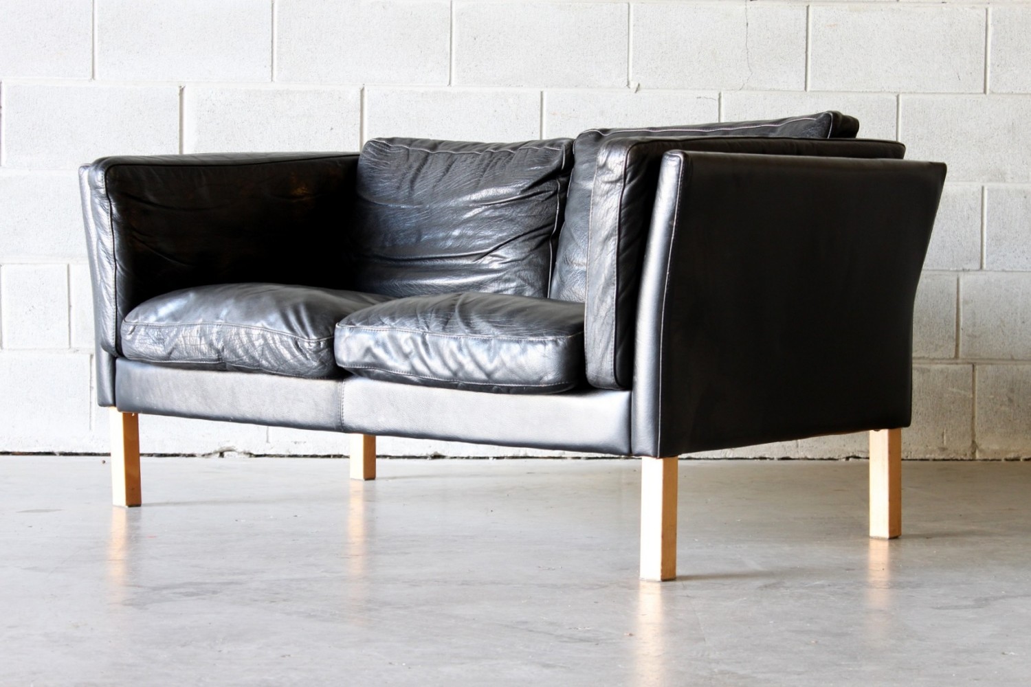 Pair of black leather vintage sofas