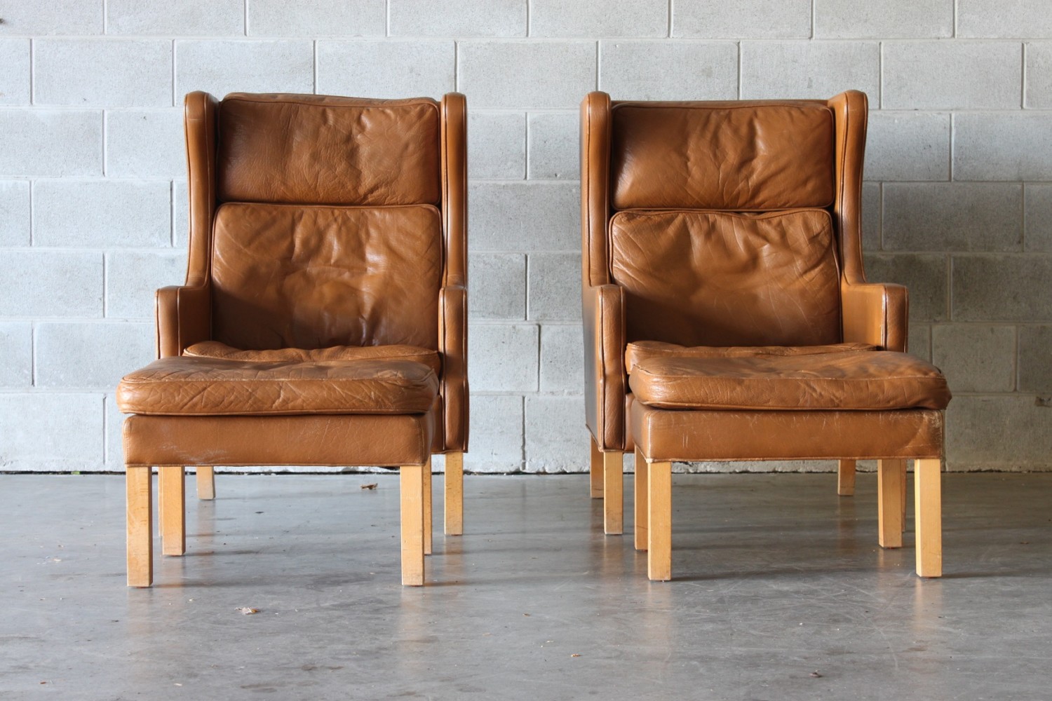 Pair of Leather Wing Back Armchairs