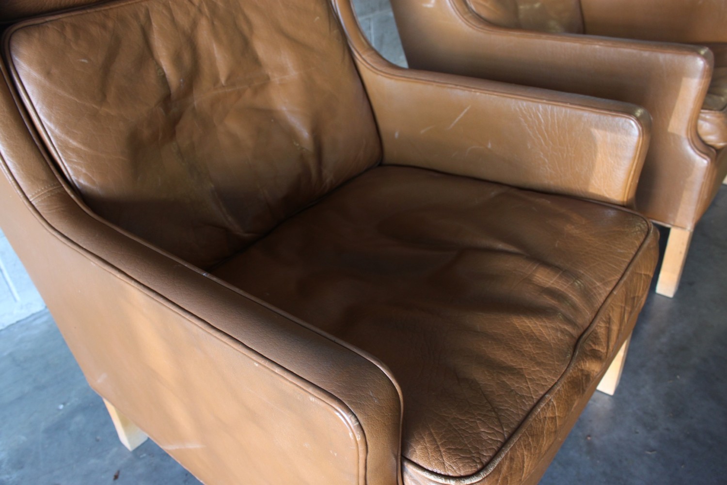 Pair of Leather Wing Back Armchairs