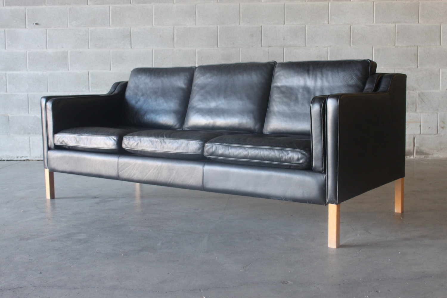 Pair of Black Leather Sofas The Vintage Shop