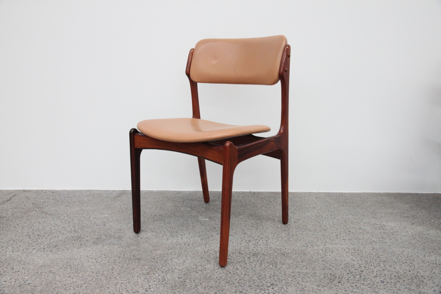 Rosewood and leather Dining Chairs by Erik Buch