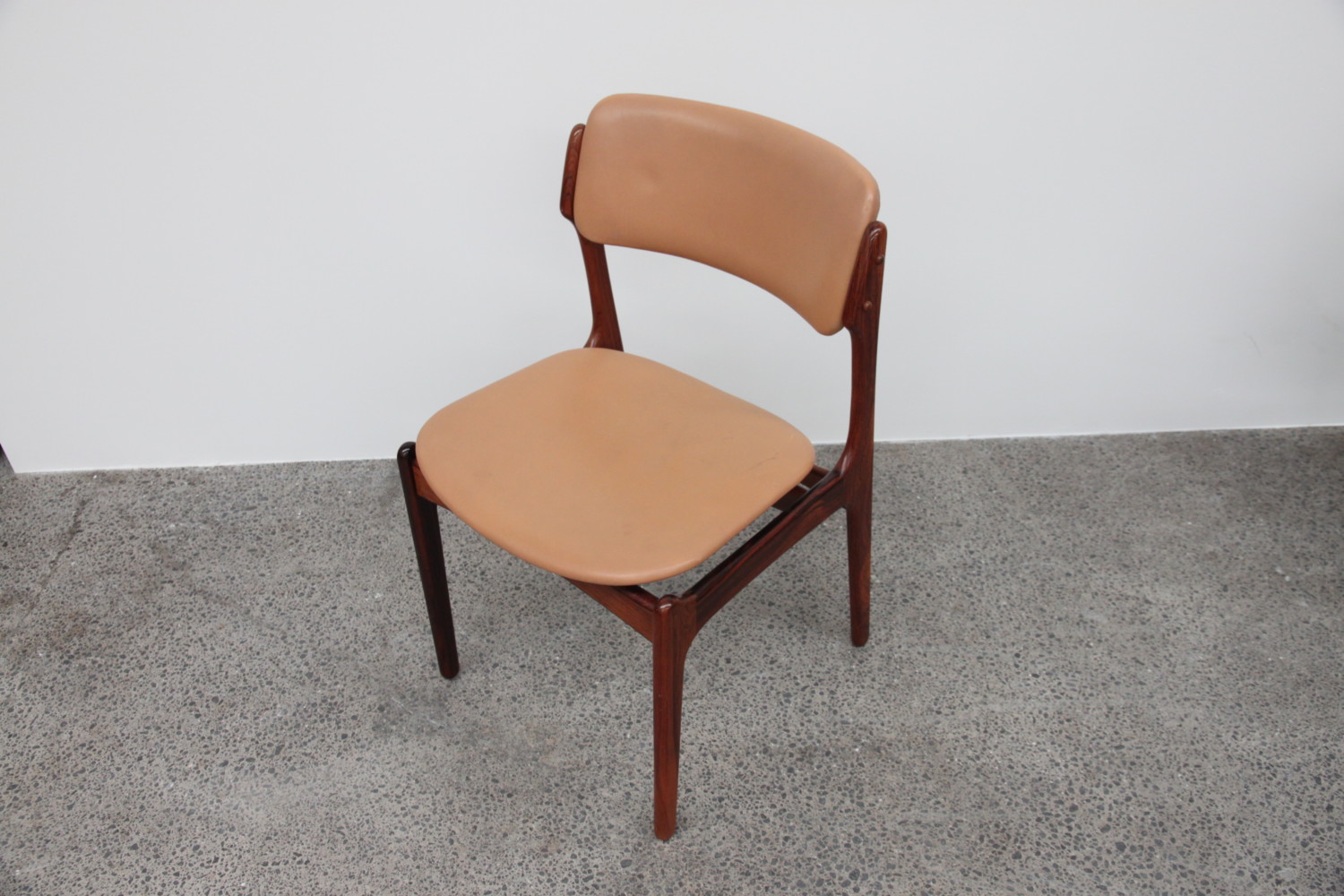 Rosewood and leather Dining Chairs by Erik Buch