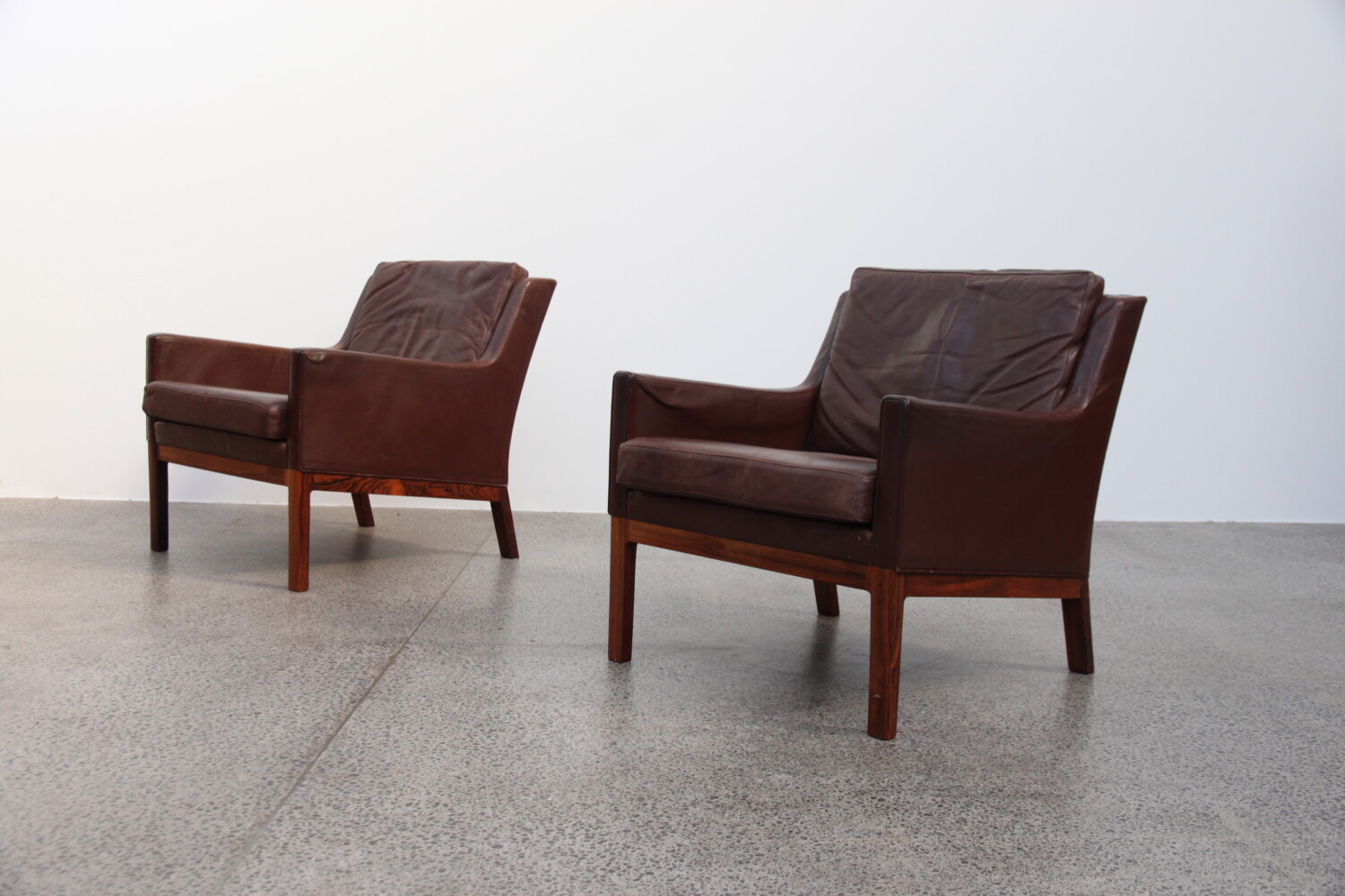 Rosewood & leather Armchairs by Kai Larsen