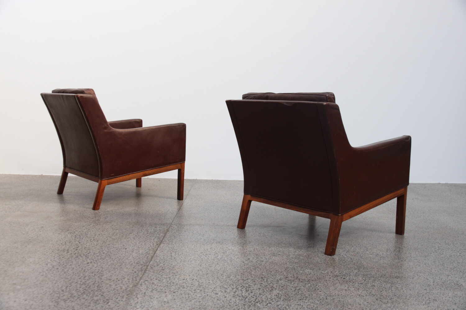Rosewood & leather Armchairs by Kai Larsen