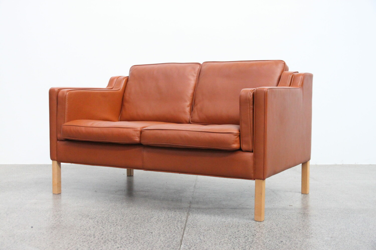 Pair of Tan Sofas with Stool by Stouby