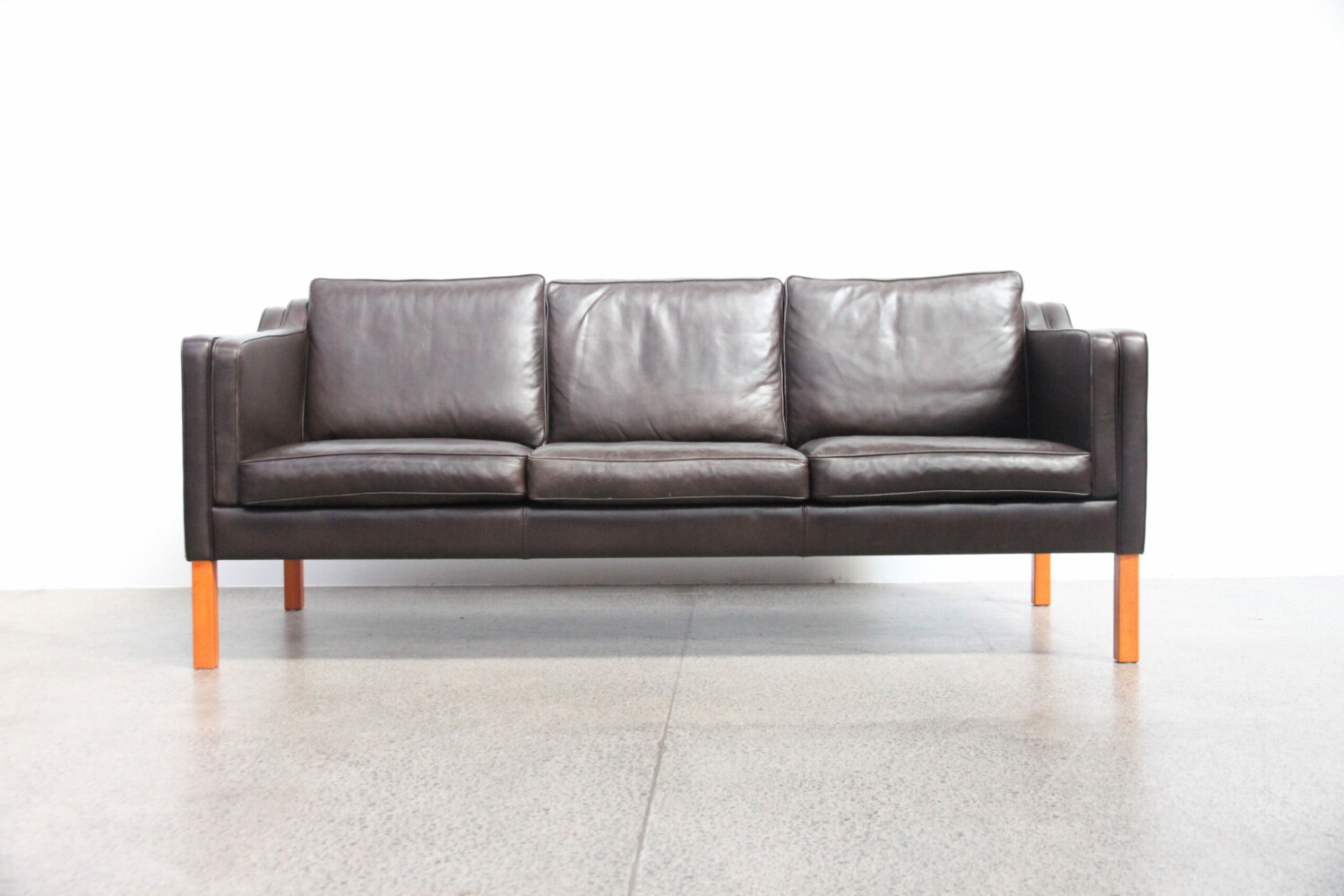 Pair of brown leather sofas