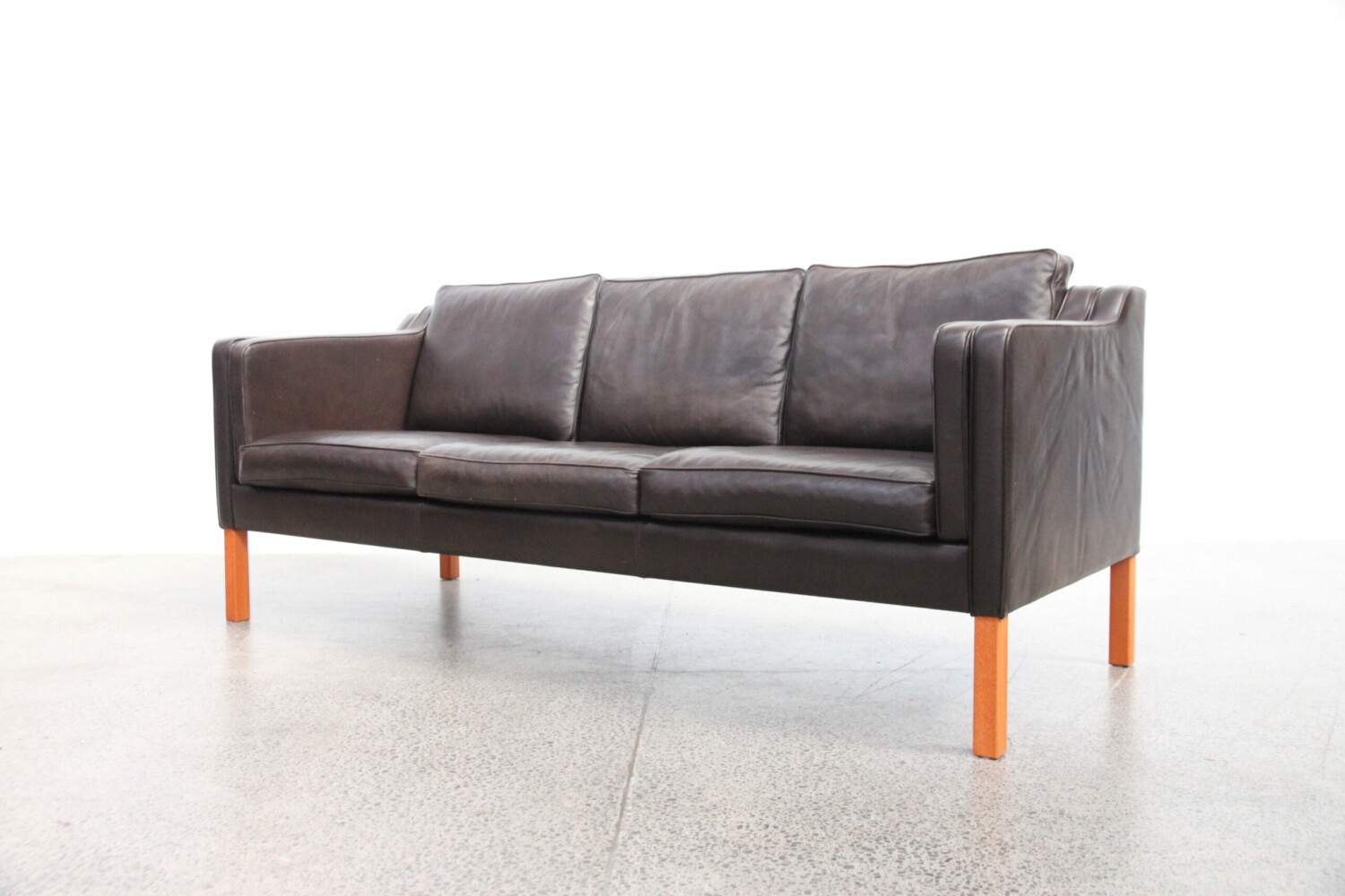 Pair of brown leather sofas