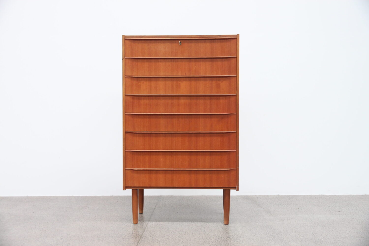 A Large 8 Drawer Teak Tallboy