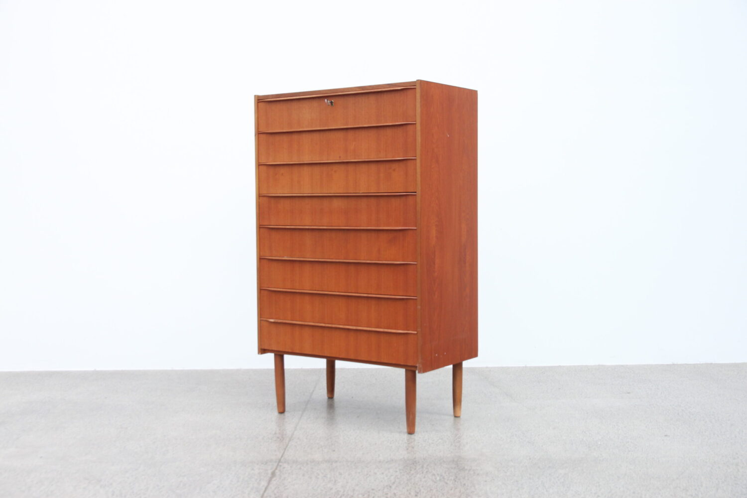 A Large 8 Drawer Teak Tallboy