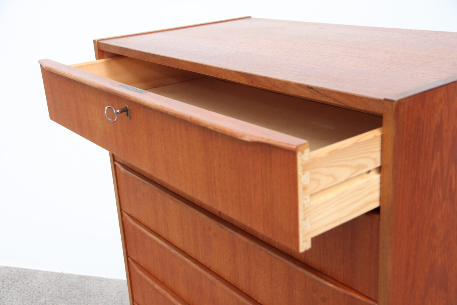 A Large 8 Drawer Teak Tallboy