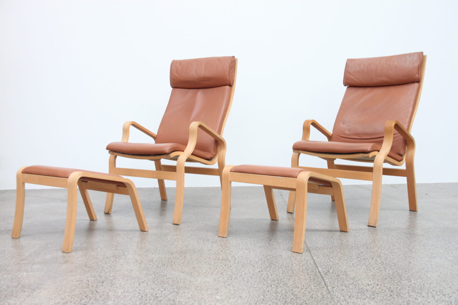 Pair of Tan Leather Armchairs by Finn Ostergaard