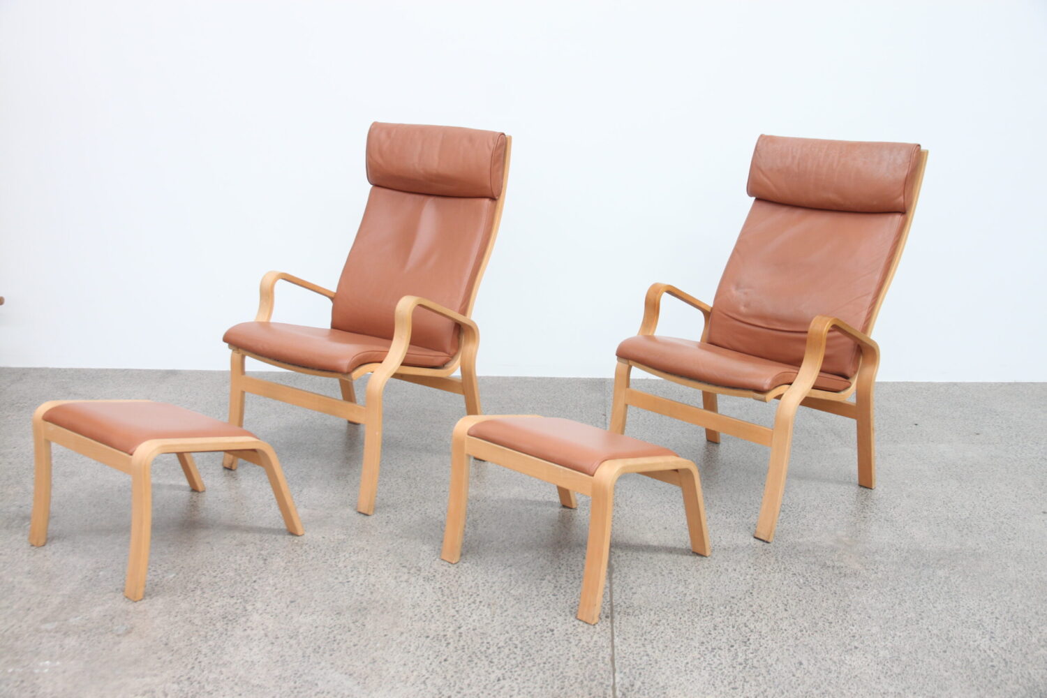 Pair of Tan Leather Armchairs by Finn Ostergaard