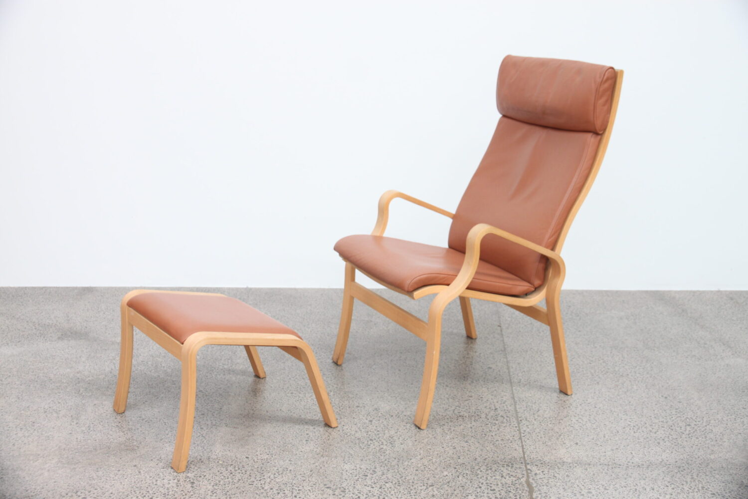 Pair of Tan Leather Armchairs by Finn Ostergaard